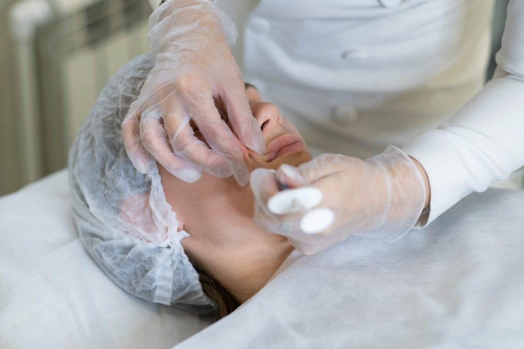 Delicate administration of a dermal filler into the nasolabial area. Reflects the high demand for