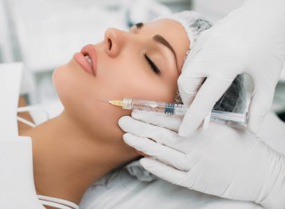woman receiving botulinum toxin injection on face